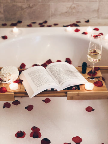 Image of bamboo bathtub caddy tray for reading watching 