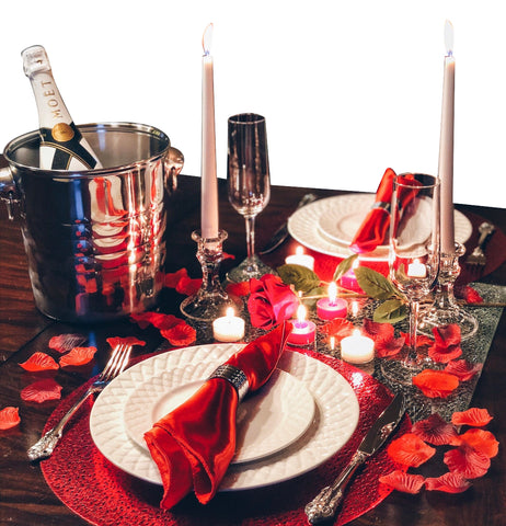 Image of stainless steel champagne bucket on a romantic dinner table setting