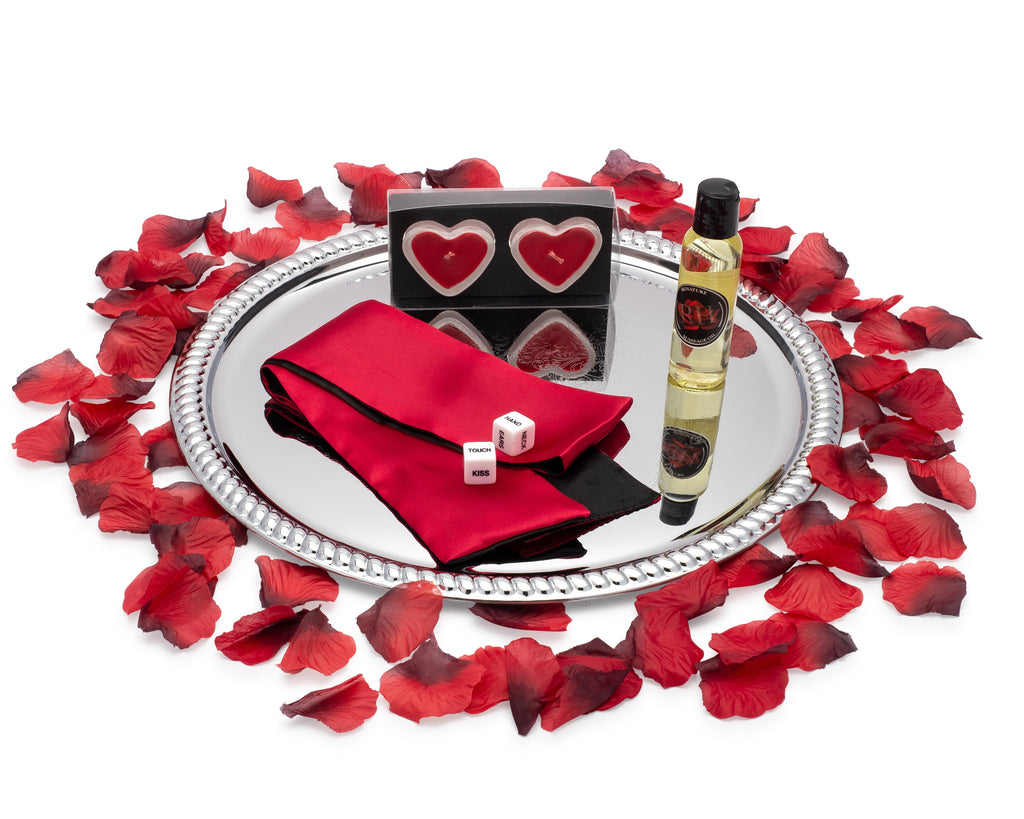 massage oil blindfold adult dice romantic candles and rose petals on a serving tray for romantic night