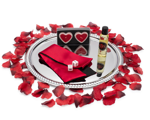 Image of massage oil blindfold adult dice romantic candles and rose petals on a serving tray for romantic night