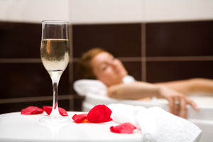 romantic bath with rose petals and candles